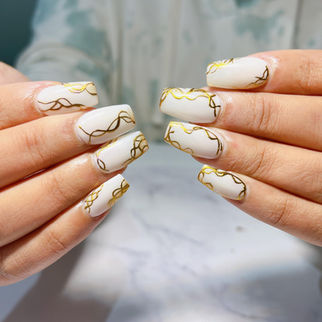 White and gold line nail art